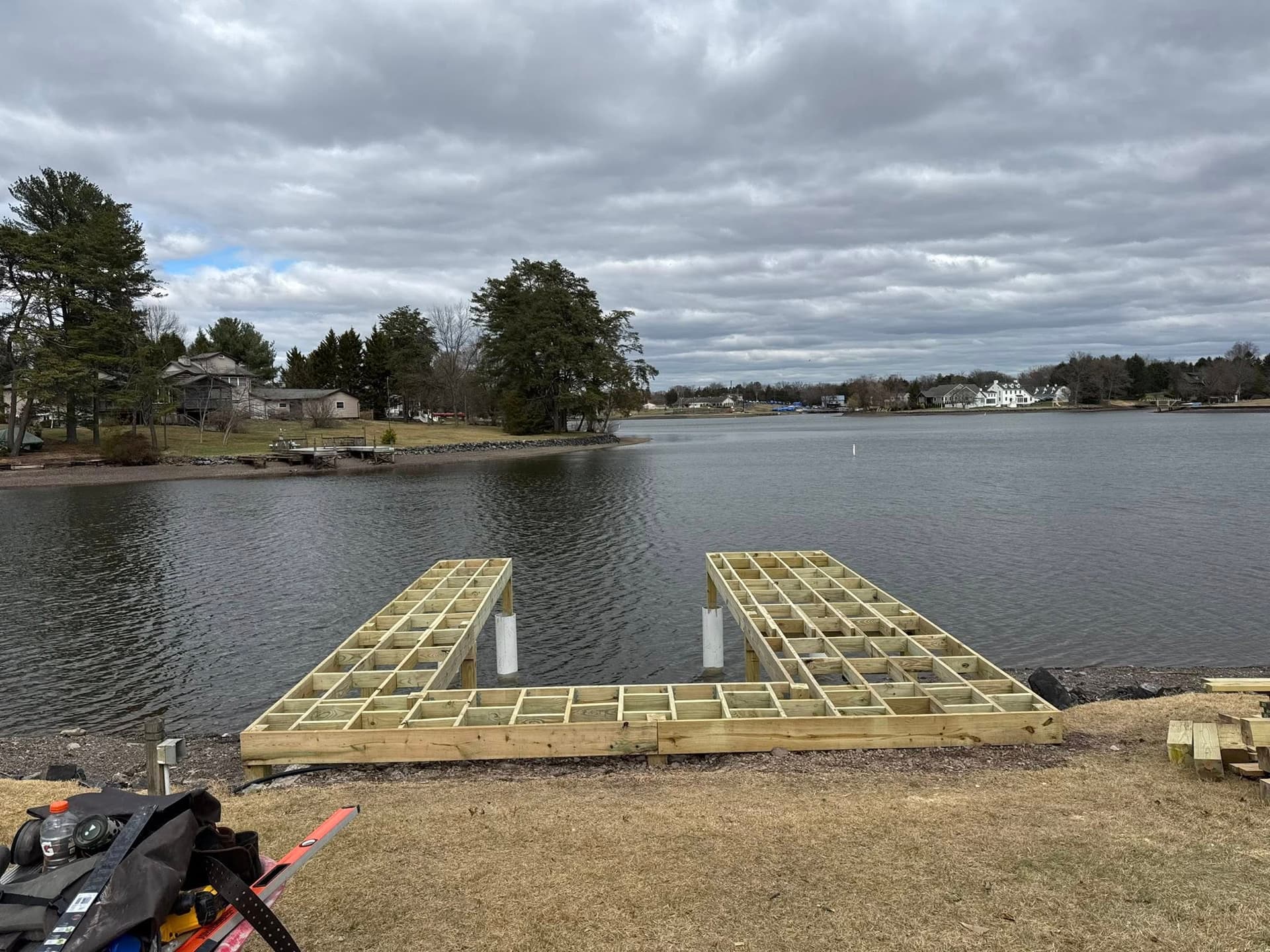 Pressure-treated dock framing over water before decking is installed
