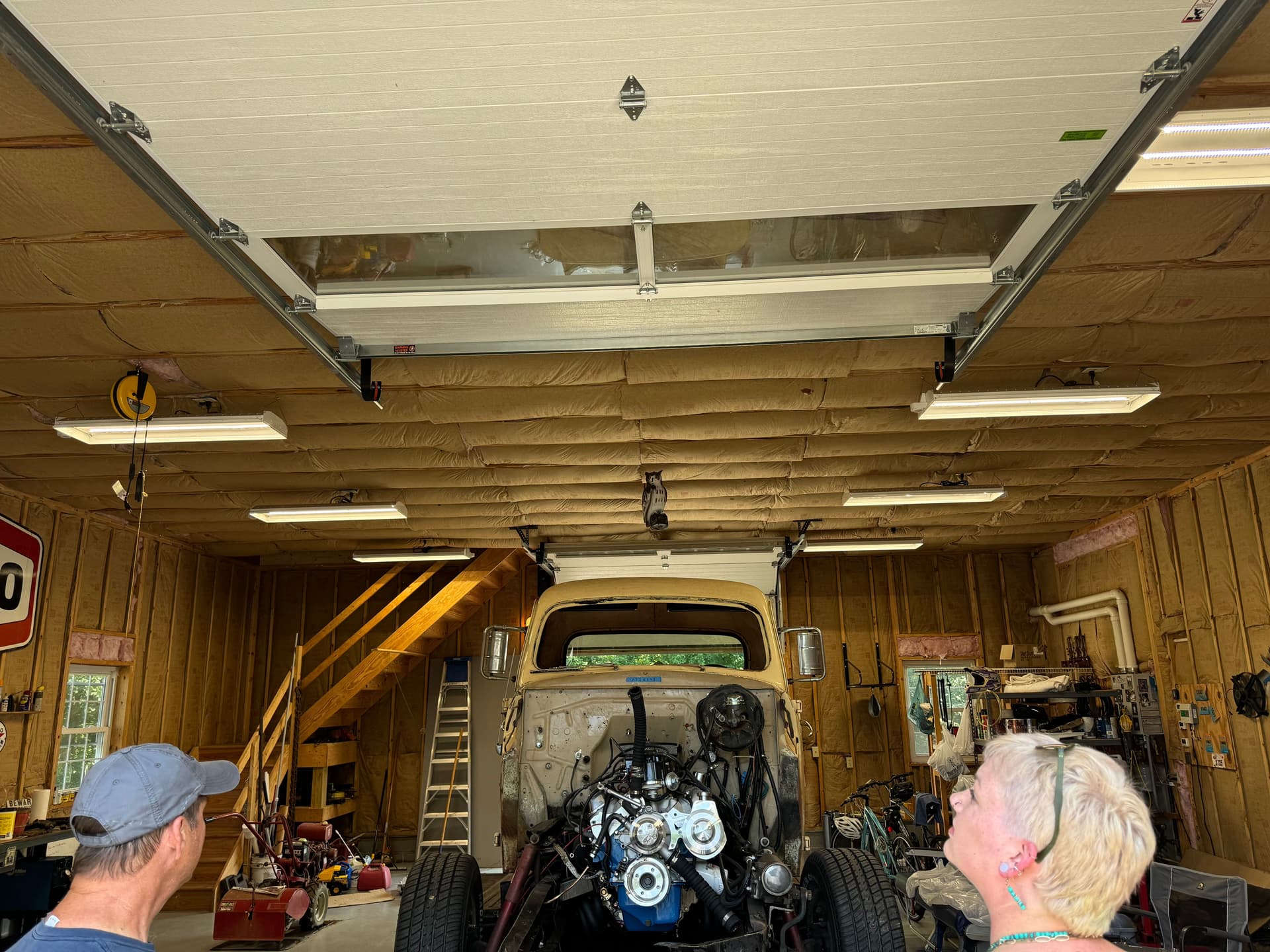 Garage interior before drywall with exposed studs and insulation